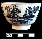 Pearlware printed underglaze blue common shape cup with Chinoisierie motif. Rim diameter:  3.25”, Base diameter:  1.50”, Vessel height: 2.00”. Lot: 7, Provenience: 1G3.872.2, Privy Stratum 2. 18BC38
